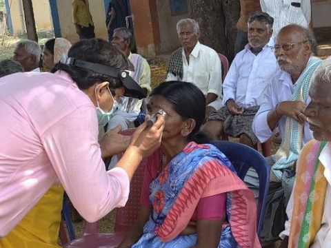 A villager is being examined by an ophthalmologist